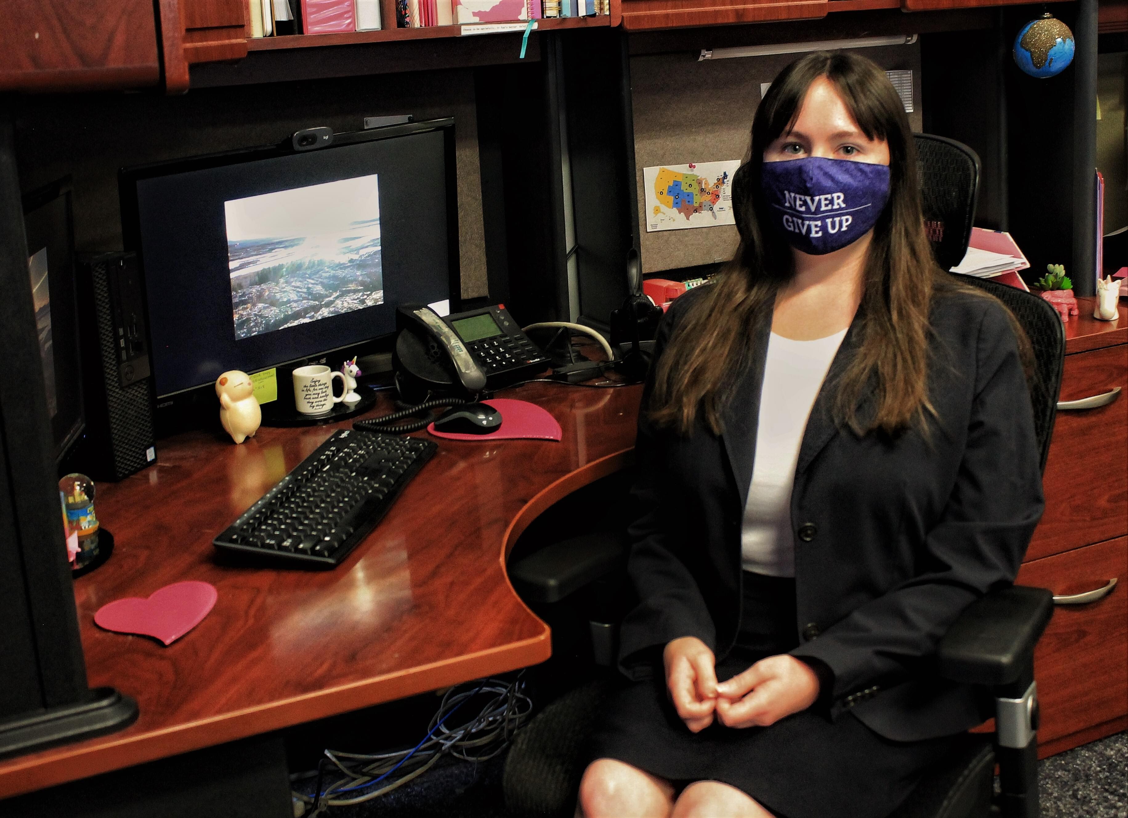 National Travel Agent at her desk